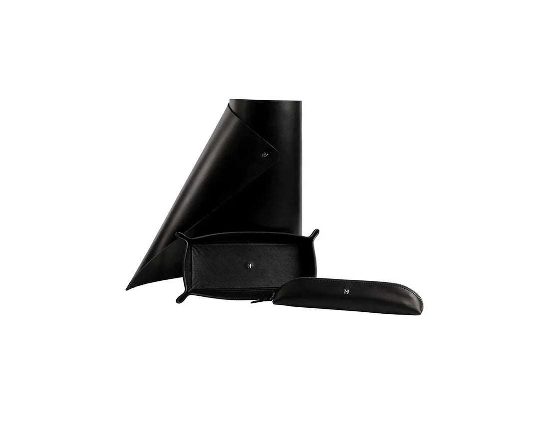 Cameron el yapımı deri masa seti, siyah renginde zarif detaylarla.